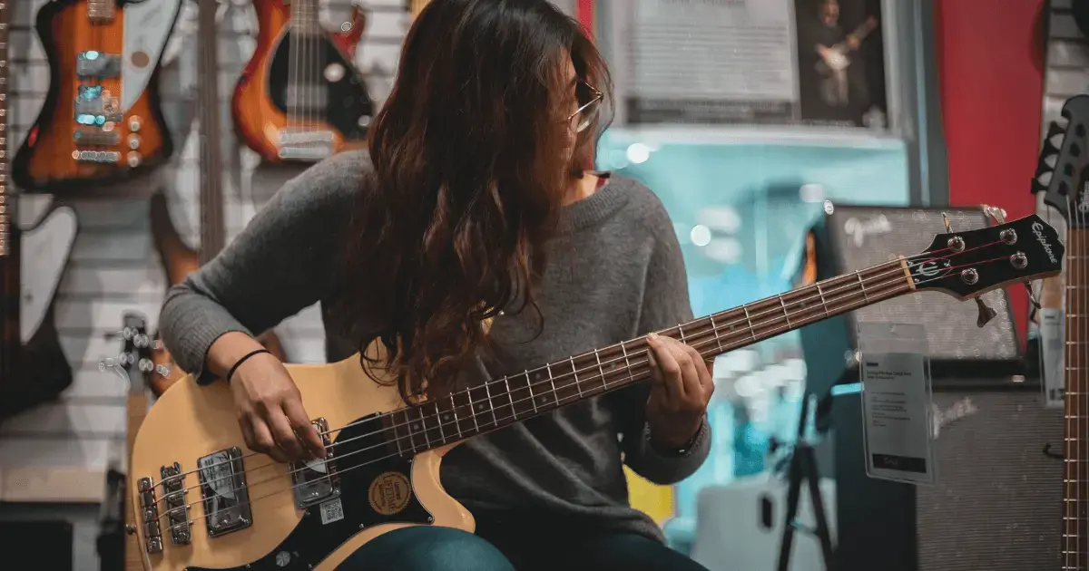 Woman playing electric guitar