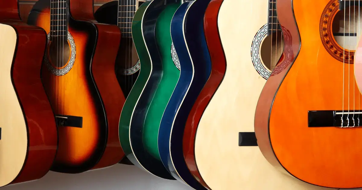 A wall of hanging acoustic guitars