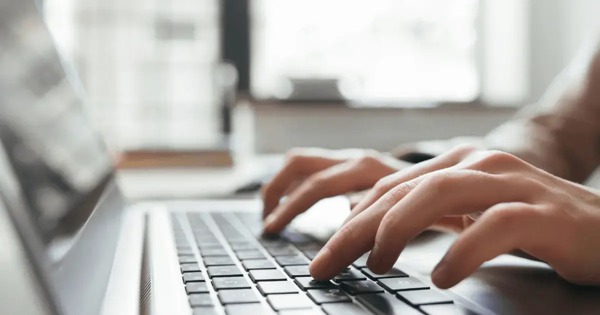 Person typing on a laptop