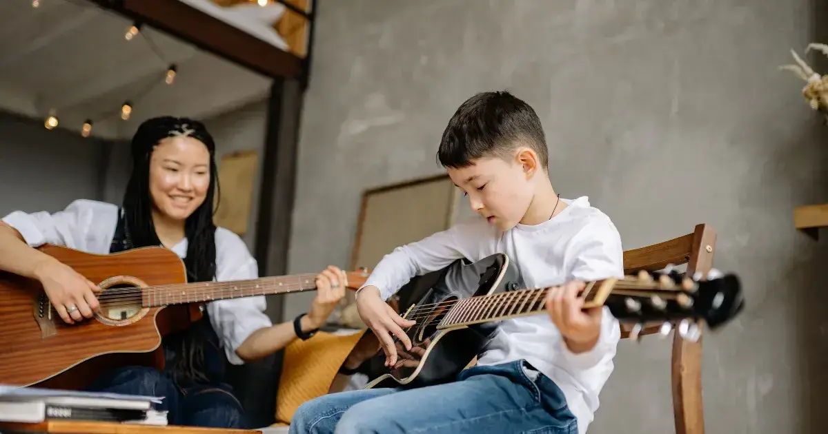 teacher and student at a guitar lesson