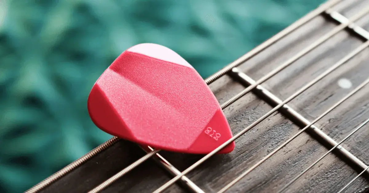 guitar pick and strings