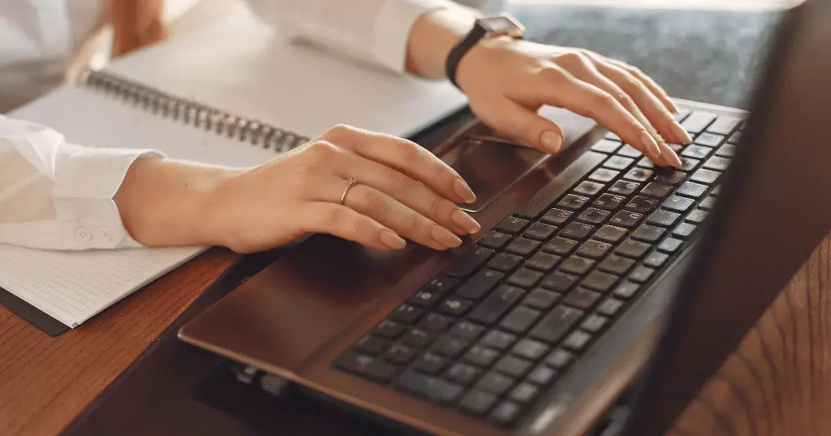 person typing on computer