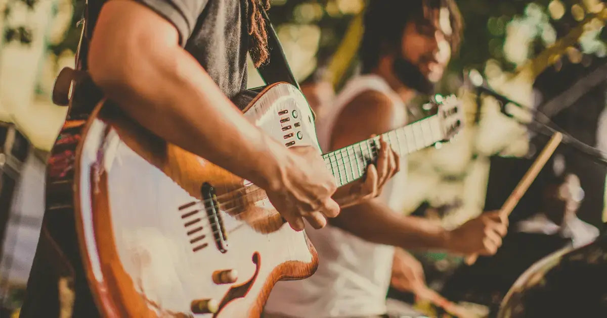 a person playing guitar on stage